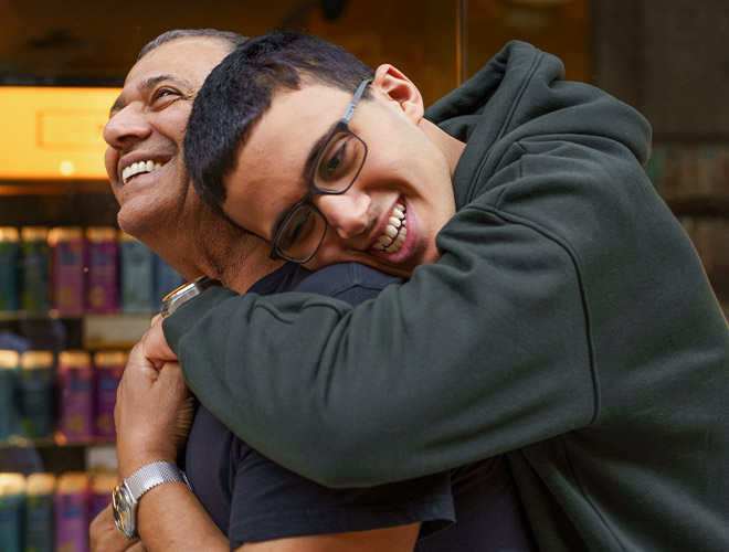 son hugging his dad no long showing the signs of mental health issues in teens
