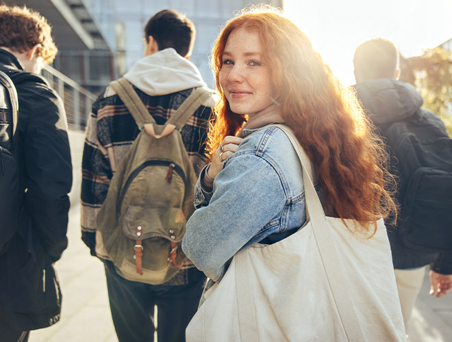 Teen girl smiling outside after Adolescent PHP or IOP Treatment